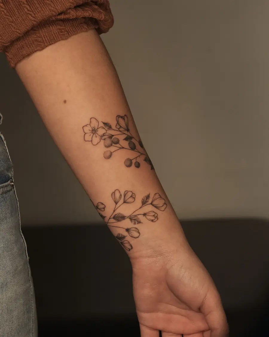 Fine line flowering branch from the wrist to mid forearm