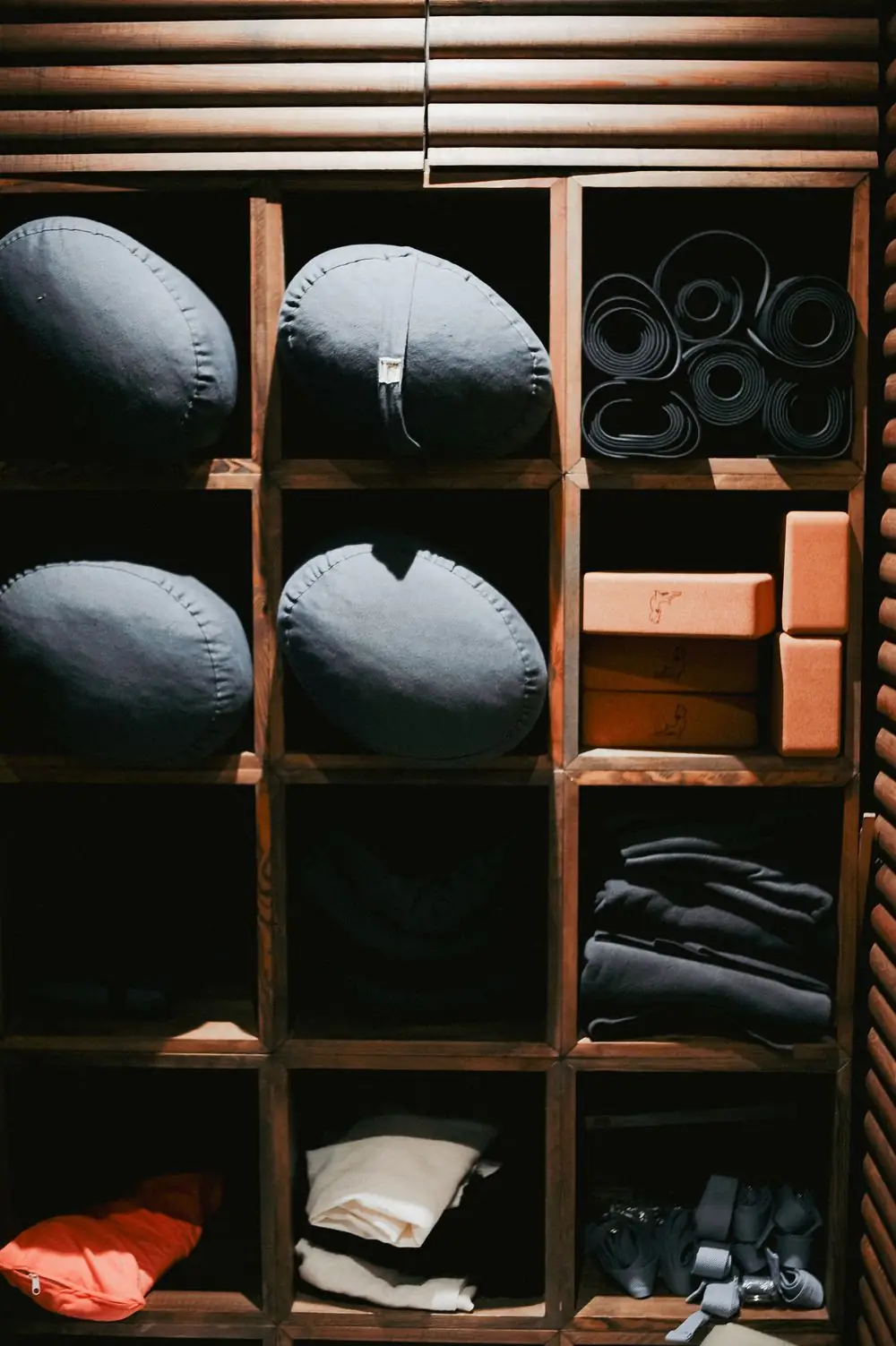 Bolsters, rolled mats and cork blocks on the studio shelves